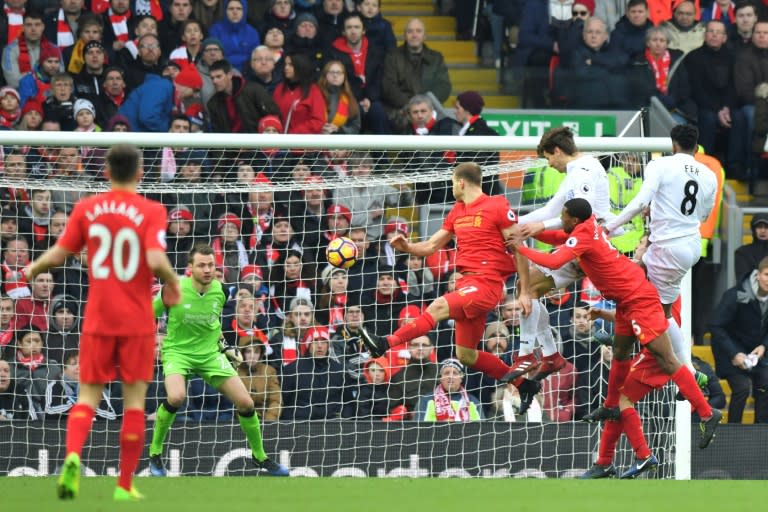 Swansea City's striker Fernando Llorente (3rdR) rises high to head the ball and score against Liverpool on January 21, 2017