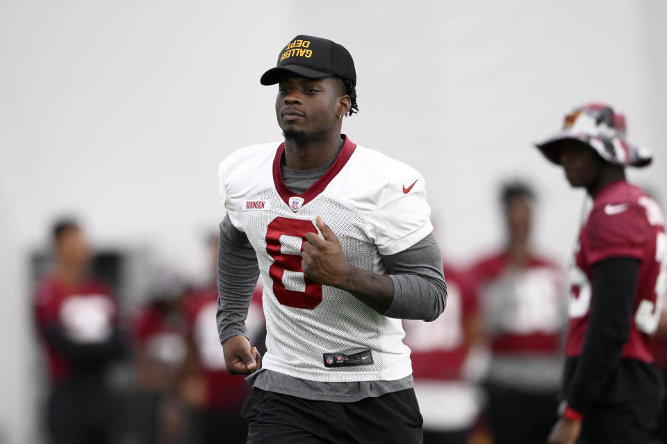 Washington Commanders running back Brian Robinson (8) runs during practice at the team's NFL football training facility, Thursday, Aug. 4, 2022 in Ashburn, Va. (AP Photo/Nick Wass)