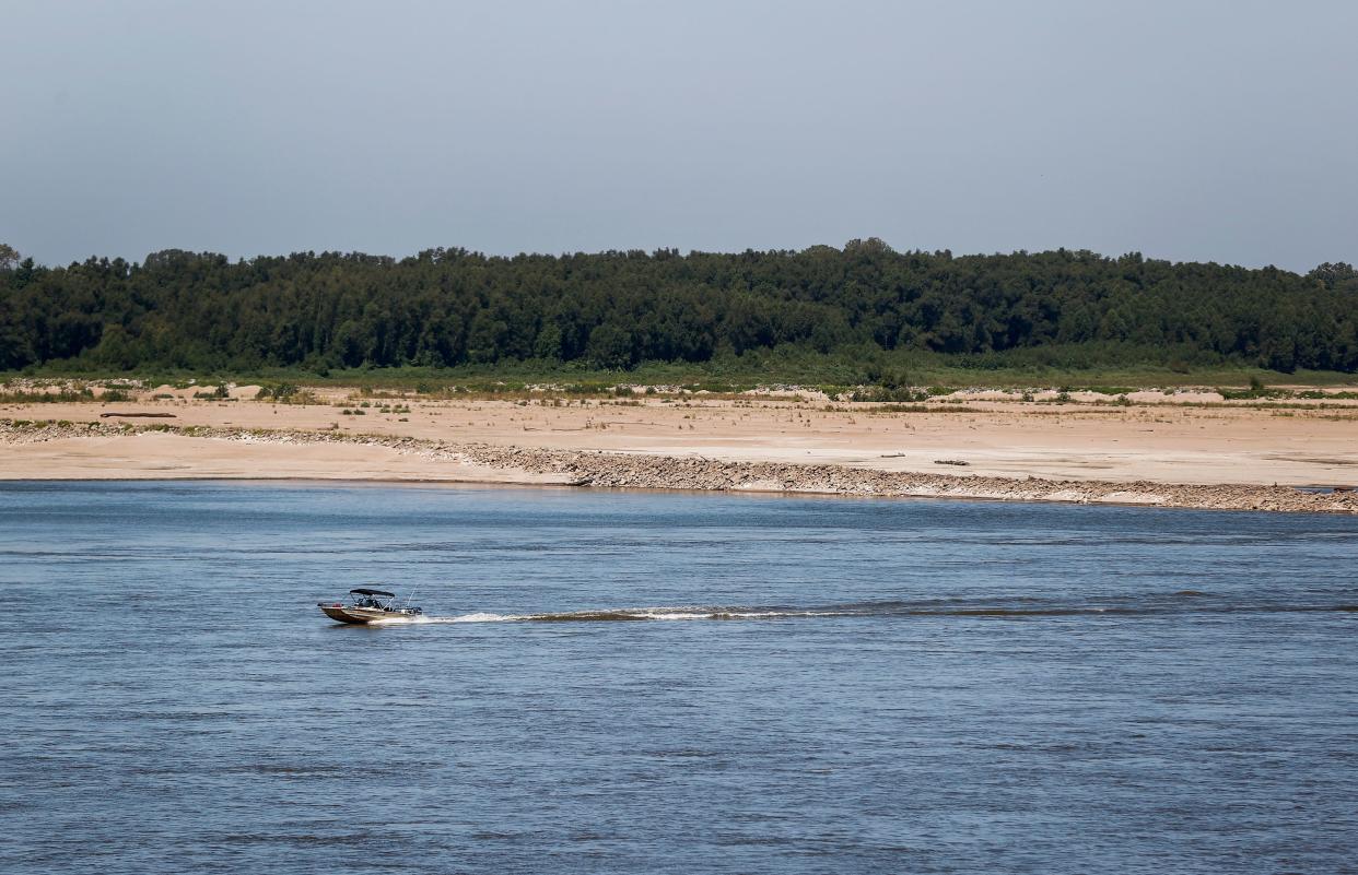 A boat plies the low waters of the Mississippi River near Memphis, Tenn., on Sept. 15.