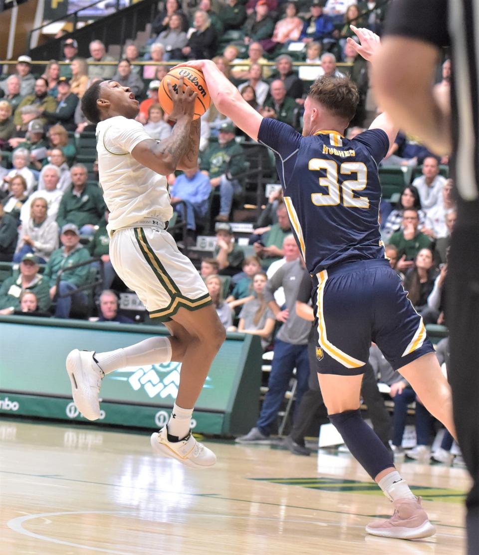 Colorado State men's basketball player Tavi Jackson has his shot blocked by Northern Colorado's Theo Hughes during a game Saturday, Dec. 3, 2022, at Moby Arena in Fort Collins, Colo.