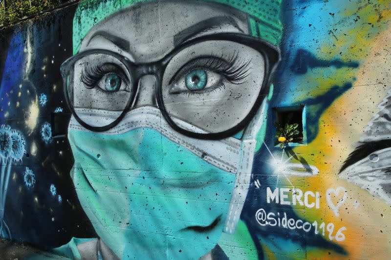 A graffiti representing a nurse is pictured on a wall in Gland