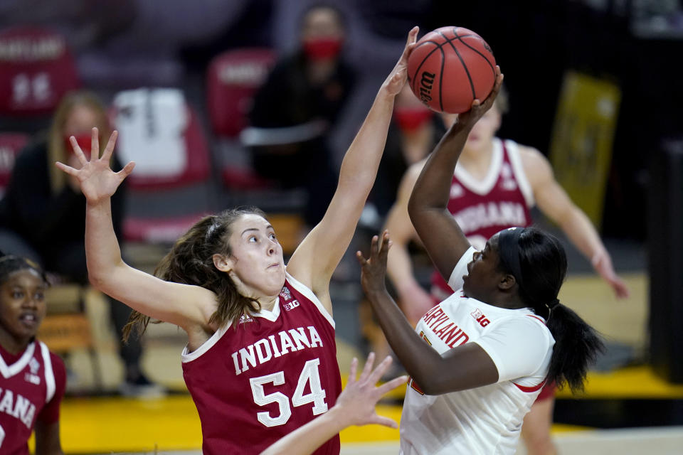 FILE - Indiana forward Mackenzie Holmes (54) blocks a shot by Maryland guard Ashley Owusu during the second half of an NCAA college basketball game in College Park, Md., in this Monday, Jan. 4, 2021, file photo. This week, No. 9 Indiana begins a new quest — dethroning No. 7 Maryland as tourney champs in Indianapolis. (AP Photo/Julio Cortez, File)