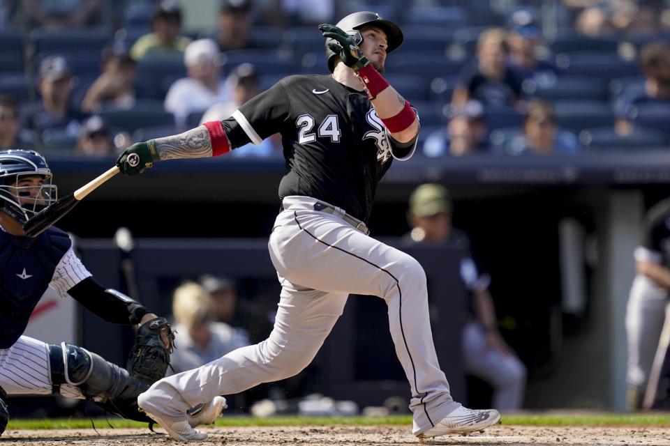 Chicago White Sox' Yasmani Grandal hits an RBI single off New York Yankees starting pitcher Jameson Taillon (50) in the fourth inning of a baseball game, Sunday, May 22, 2022, in New York. (AP Photo/John Minchillo)