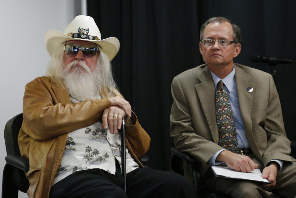 Leon Russell, left, leans on his cane as he sits with Bob Blackburn, executive director of the Oklahoma Historical Society, in Tulsa, Okla., Tuesday, Jan. 29, 2013. The Oklahoma Historical Society has acquired a large collection of works by the legendary musician and native Oklahoman that are intended for display in a planned pop culture museum in Tulsa. (AP Photo/Sue Ogrocki)