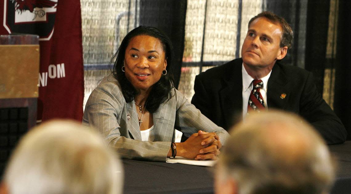 From Saturday, May 10, 2008: South Carolina’s new women’s basketball coach Dawn Staley, left, and USC media relations director Steve Fink, right, listen to USC director of athletics Eric Hyman talk about Staley’s career during her introductory news conference.