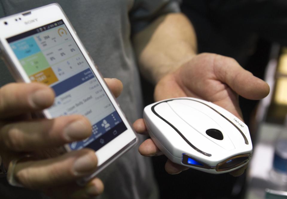 A Tao WellShell is displayed during "CES Unveiled," a media preview event to the annual Consumer Electronics Show (CES), in Las Vegas, Nevada, January 5, 2014. The WellShell is an electronic isometric device but also monitors various fitness levels and transmits the data to a smartphone. (REUTERS/Steve Marcus)