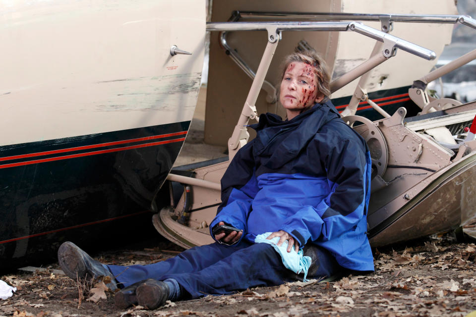 Arizona lying against the plane that crashed