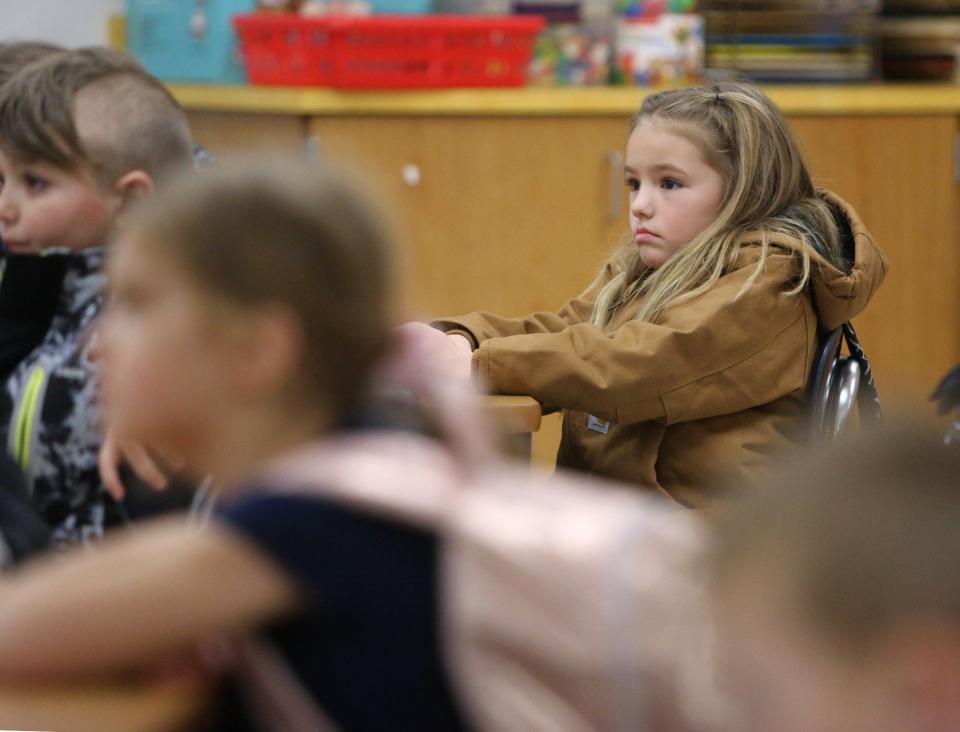 Jersi Eberhardt watches a cartoon before the end of the school day at Tuslaw Elementary School on Friday. Masks are optional for students in the district.