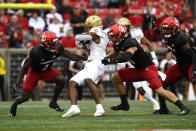 Louisville defensive back Chandler Jones (2), left, and safety Shavarick Williams (30) converge on Boston College wide receiver Zay Flowers (4) during the first half of an NCAA college football game in Louisville, Ky., Saturday, Oct. 23, 2021. (AP Photo/Timothy D. Easley)