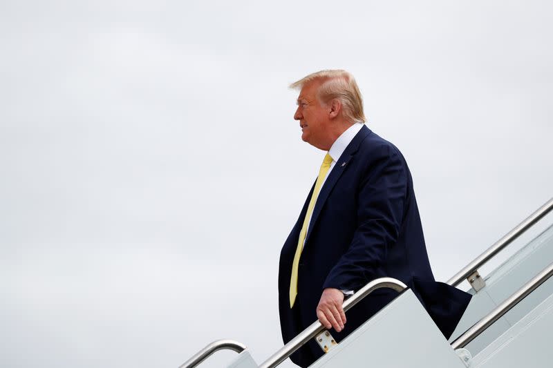 U.S. President Donald Trump descends from Air Force One at Orlando Sanford International Airport in Sanford, Florida