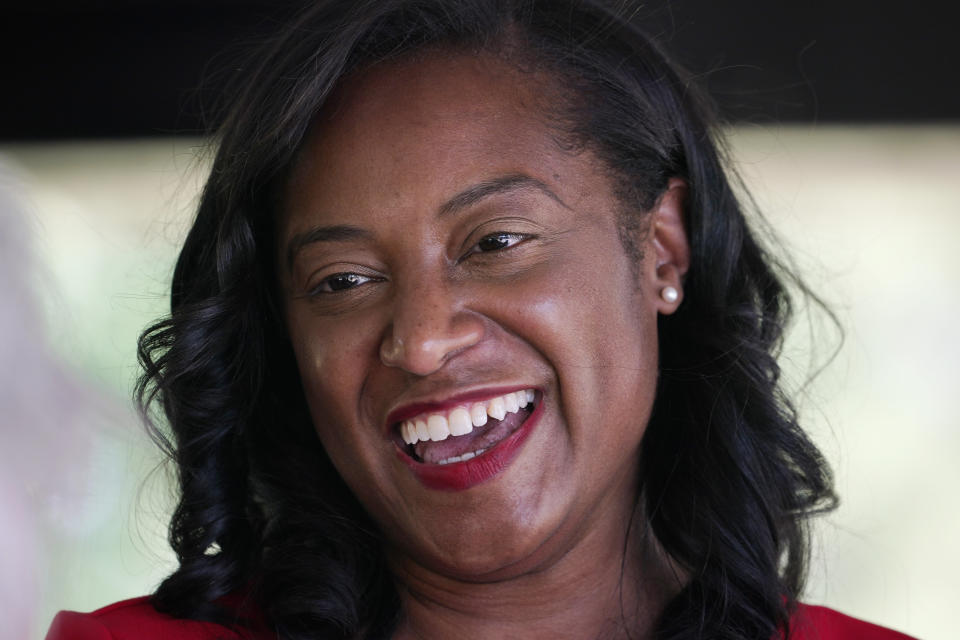 Democratic gubernatorial candidate, former Del. Jennifer Carroll Foy, smiles as she talks to supporters during a rally in Hampton, Va., Tuesday, June 1, 2021. Carroll Foy faces four other Democrats in the primary June 8. (AP Photo/Steve Helber)