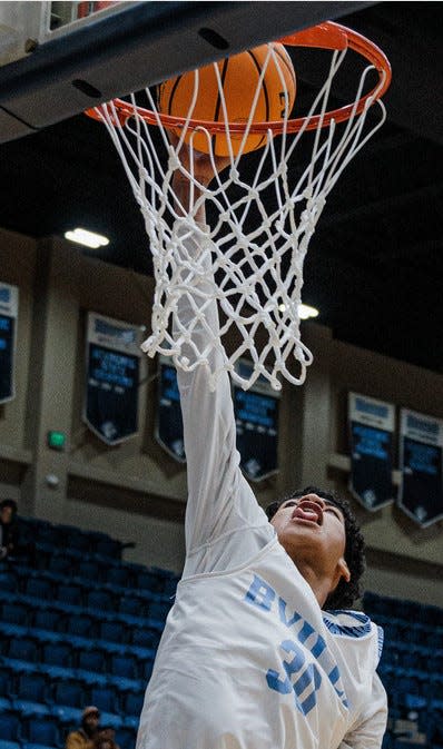 Jacob Veit puts the ball in the bucket during the Bartlesville High basketball Hype Night on Nov. 29, 2022.