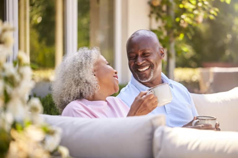 Retirees sip their morning coffee outside.