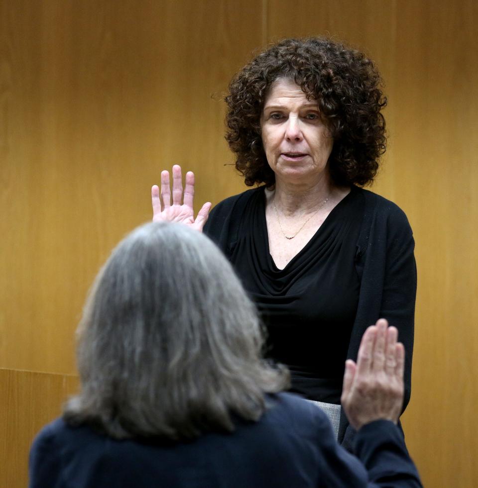 Christopher Gregor's mother Carolyn Gregor is sworn in to testify Thursday, May 9, 2024, for a hearing before Superior Court Judge Guy P. Ryan in Toms River. Her son is charged with the 2021 murder and child endangerment of his 6-year-old son Corey Micciolo.