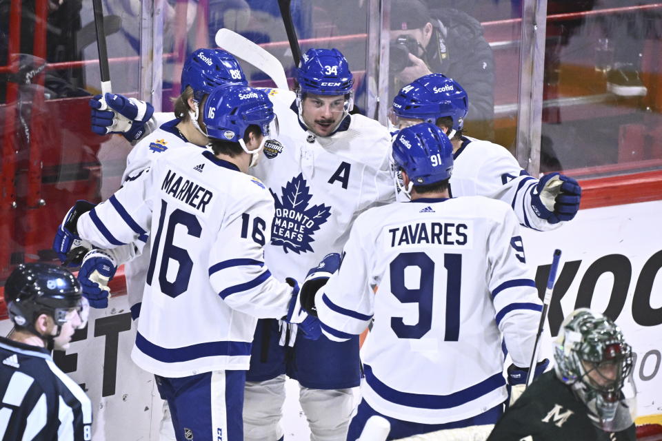 Toronto's Auston Matthews, center, celebrates scoring with teammates during the NHL Global Series Sweden ice hockey match between Toronto Maple Leafs and Minnesota Wild at Avicii Arena in Stockholm, Sweden, Sunday, Nov. 19, 2023.(Claudio Bresciani/TT via AP)