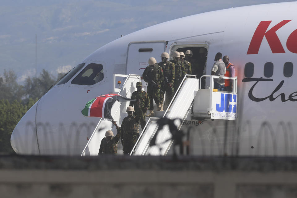 Police from Kenya deplane at the Toussaint Louverture International Airport in Port-au-Prince, Haiti, Tuesday, June 25, 2024. The first U.N.-backed contingent of foreign police arrived nearly two years after the Caribbean country requested help to quell a surge in gang violence. (AP Photo/Odelyn Joseph)