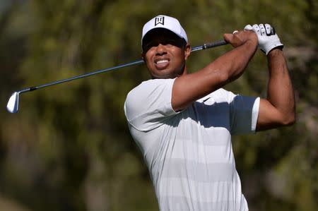 Feb 16, 2018; Pacific Palisades, CA, USA; Tiger Woods plays his shot from the fourth tee during the second round of the Genesis Open golf tournament at Riviera Country Club. Mandatory Credit: Orlando Ramirez-USA TODAY Sports