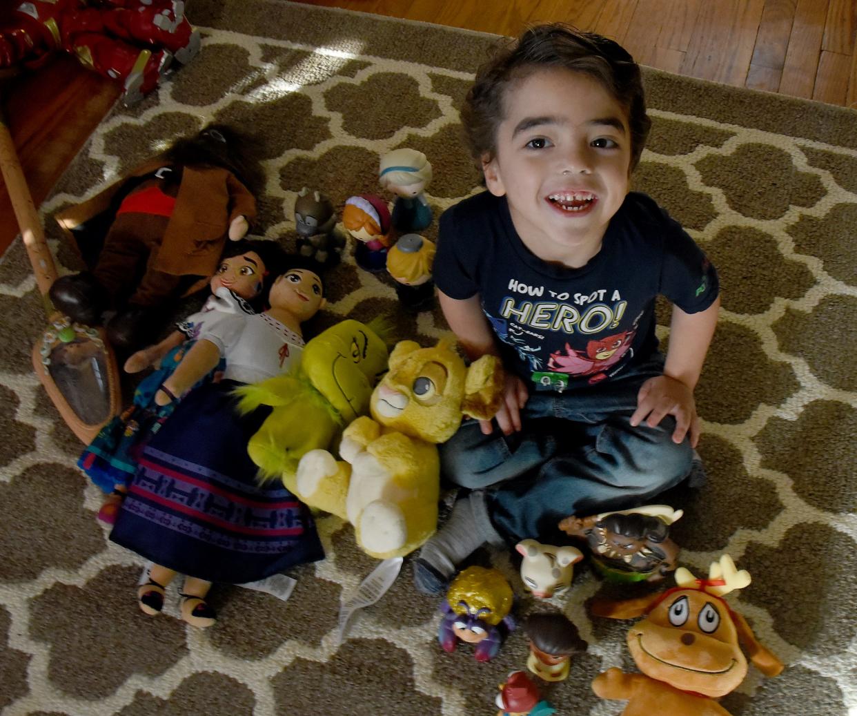 Elliott Althouse, of Monroe, who turns 5 years old today, sits in his home surrounded by the items he brought back from his family's recent trip to Walt Disney World which was provided by the Make-A-Wish Foundation. Elliott is dealing with a very rare syndrome called Lennox-Gastaut Syndrome, a lifelong and aggressive form of epilepsy.