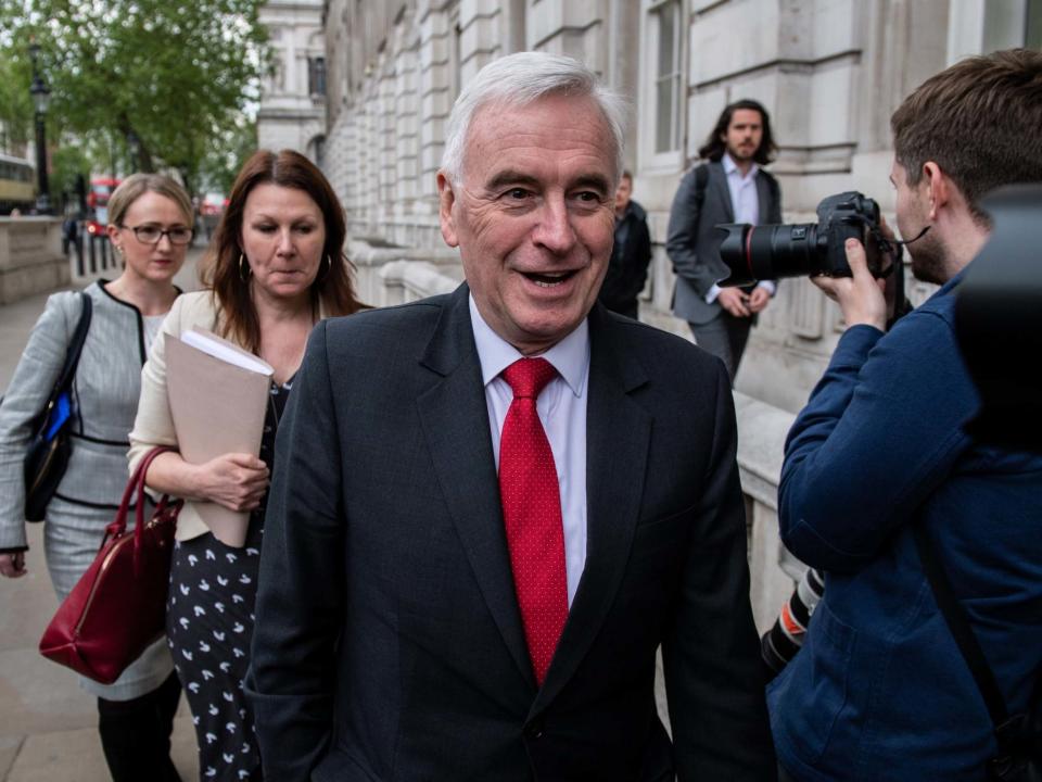Labour is considering adopting radical climate change plans to push for net-zero carbon emissions by 2030, John McDonnell has said.The shadow chancellor revealed serious thought was going into reducing the deadline by two decades, in line with demands for more radical action from activists.Theresa May announced plans to introduce a legally-binding target to end greenhouse gas emissions by 2050, following recommendations from the government’s independent climate change advisers.Her attempt to bolster her Downing Street legacy triggered a row with the Treasury, amid reports that Philip Hammond, the chancellor, tried to block the decision by claiming it would hit the economy by more than £1 trillion.Labour has faced pressure to shift its own stance from left-wing activists.Ahead of the party's autumn conference, Momentum, the influential grassroots network, has thrown its weight behind a “green new deal”, which includes a 2030 target.Mr McDonnell said he has been holding talks with environmental protesters on how to reduce the 2050 target, including Extinction Rebellion, who took over London with widespread protests.“Our target was no later than 2050, basically, but it wasn’t a fixed target and I think we’re going to have to pull that back in the light of the science that we now know,” Mr McDonnell told the Financial Times.He said: “I want to aim for 2030 if I can, of course, but at the moment all the advice that we’re getting is that that isn’t realistic.“So we’ve got to test that and look at the range of policies we need to enable that to happen.”The shadow chancellor said the next Labour government would commit to £500bn of capital investment over the next ten years, which would include investment in decarbonisation.Mr McDonnell said: “We have to work with experts about what strategic interventions the state could make.”A net-zero target means the amount of greenhouse gas emissions added to the earth's atmosphere would be balanced by the amount taken out, by planting trees or using carbon capture and storage schemes.Hitting net zero will involve sweeping lifestyle changes, such as end to use of gas boilers, switching to electric cars and a greater reliance on green technologies.Ms May announced plans to scrap the old target of reducing emissions by 80 per cent in 2050 this week, following the advice from the Committee on Climate Change (CCC) in May. Scotland has already committed to a 2045 net-zero target, and there are calls for the government to be more ambitious, with Friends of the Earth warning it was “still too slow to address catastrophic climate change”.Announcing her plans, the prime minister said: “As the first country to legislate for long-term climate targets, we can be truly proud of our record in tackling climate change. We have made huge progress in growing our economy and the jobs market while slashing emissions.“Now is the time to go further and faster to safeguard the environment for our children. This country led the world in innovation during the Industrial Revolution, and now we must lead the world to a clear, greener form of growth. “Standing by is not an option. Reaching net zero by 2050 is an ambitious target, but it is crucial that we achieve it to ensure we protect our planet for future generations.”