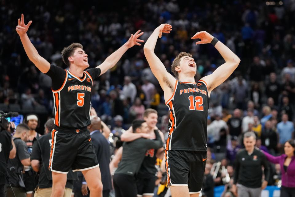 Princeton Tigers forward Caden Pierce (12) and guard Jack Scott (5) celebrate after defeating the Missouri Tigers.