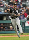 Chicago White Sox's Yoan Moncada throws out Cleveland Indians' Austin Hedges in the fifth inning in the first baseball game of a doubleheader, Thursday, Sept. 23, 2021, in Cleveland. (AP Photo/Tony Dejak)