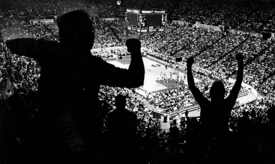 Fans cheer as they watch a Cavs game at the Coliseum in Richfield. The arena opened in 1974 and was torn down in 1999.