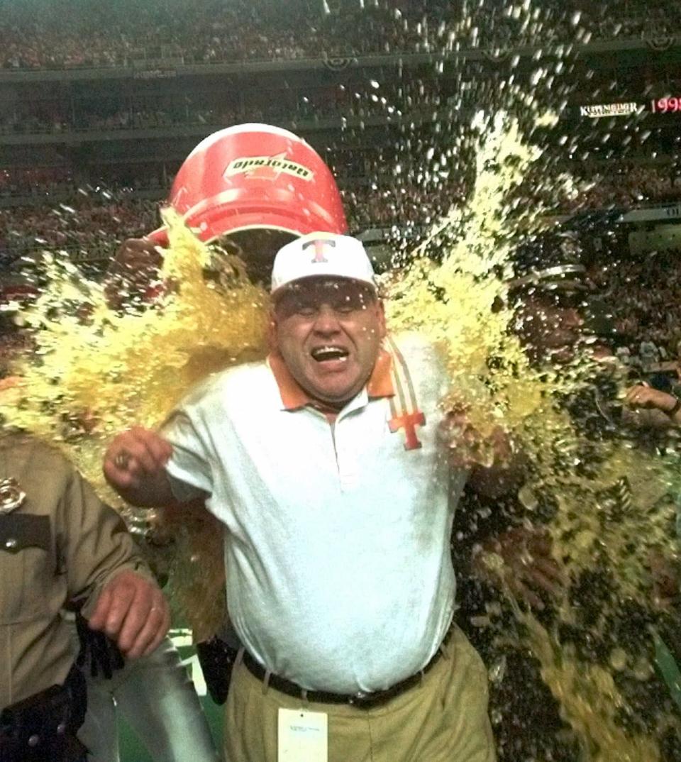 Tennessee coach Phil Fulmer gets doused with Gatorade following the Volunteers 24-14 win over Mississippi State in the SEC Championship game at the Georgia Dome in Atlanta on Saturday, Dec. 5, 1998. (AP Photo/Dave Martin)