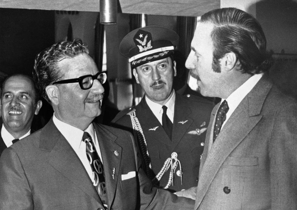 Chilean President Salvador Allende, left, talks to Orlando Letelier, Chilean Ambassador to Washington in Quito, Ecuador on Aug. 26, 1971.