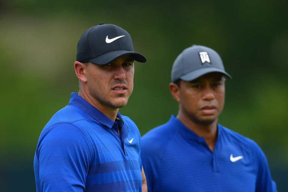 ST LOUIS, MO - AUGUST 08:  Brooks Koepka (L) and Tiger Woods (R) of the United States look on during a practice round prior to the 2018 PGA Championship at Bellerive Country Club on August 8, 2018 in St Louis, Missouri.  (Photo by Stuart Franklin/Getty Images)