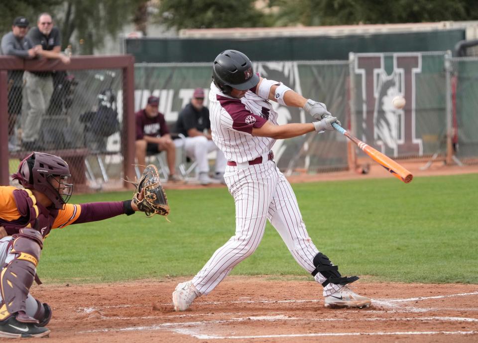 Hamilton's Liam Wilson swings at a pitch during a game against Tolleson at Hamilton HS baseball field.