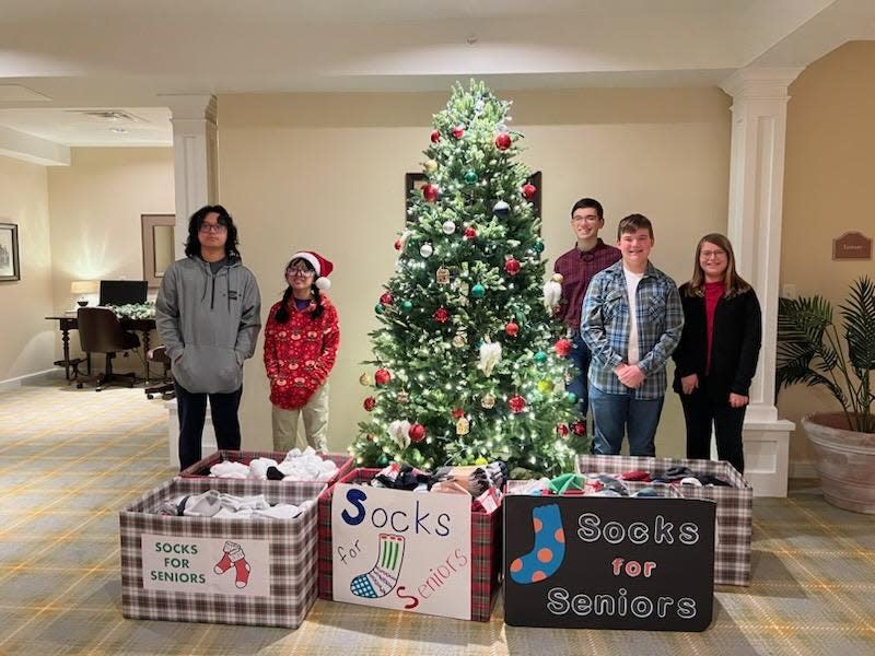 From left to right, Granville students JV Kirby, ninth grade; Kara Kirby, fifth grade; Benjamin Prokop, ninth grade; Daniel Prokop, seventh grade; and Rebekah Prokop, sixth grade, collected more than 1,000 pairs of socks for Licking County senior citizens. The socks were donated to local aging organizations and nursing facilities.