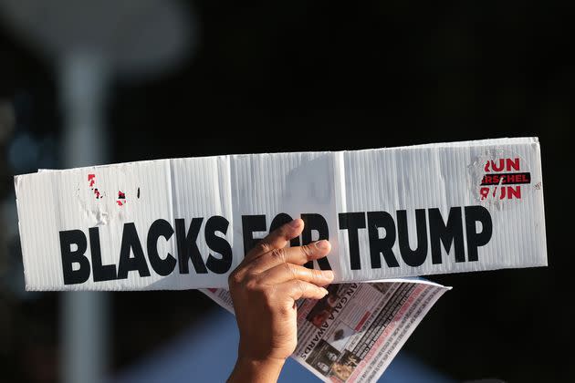 A Donald Trump supporter holds a sign outside a federal courthouse in Miami on June 13, 2023, before the former president's arraignment in the classified documents case.