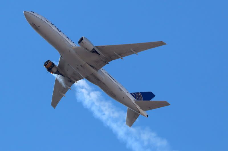 FILE PHOTO: FILE PHOTO: United Airlines flight UA328 returns to Denver International Airport with its starboard engine on fire after it called a Mayday alert