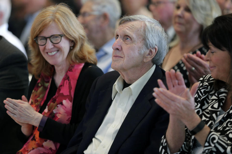 FILE - Ken Squier watches a video after being named as a member of the class of 2018 during an announcement at the NASCAR Hall of Fame in Charlotte, N.C., May 24, 2017. Squier, a longtime NASCAR announcer, has died. Squier died Wednesday night, Nov. 15, 2023, in Waterbury, Vermont, at the age of 88, according to the management of the local WDEV radio, which he owned. (AP Photo/Chuck Burton, File)