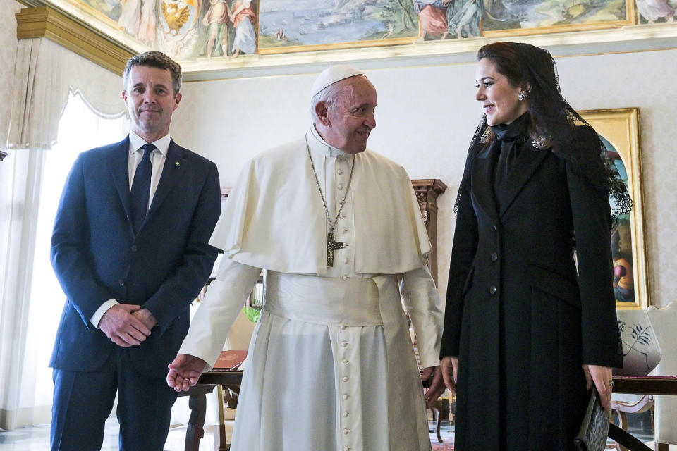 FILE - Pope Francis talks with Danish Crown Prince Frederik, left, and his wife Crown Princess Mary, on the occasion of their private audience, at the Vatican, Thursday, Nov. 8, 2018. As a teenager, Crown Prince Frederik felt uncomfortable being in the spotlight, and pondered whether there was any way he could avoid becoming king. All doubts have been swept aside as the 55-year-old takes over the crown on Sunday, Jan. 14, 2024 from his mother, Queen Margrethe II, who is breaking with centuries of Danish royal tradition and retiring after a 52-year reign. (Angelo Carconi/Pool Photo via AP, File)