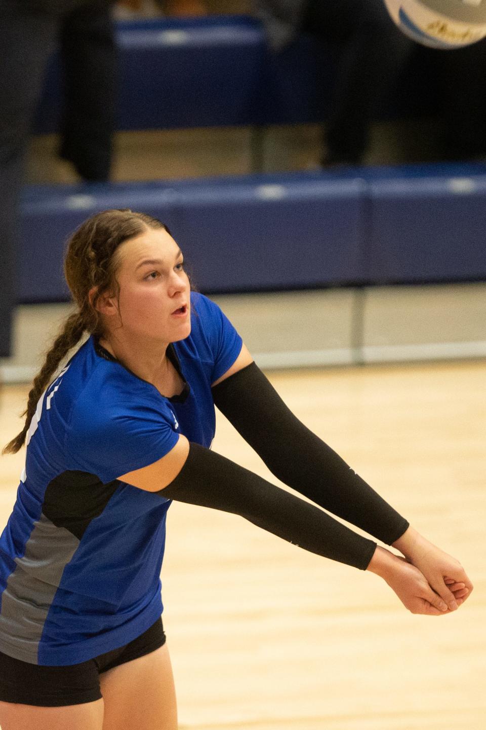 Washburn Rural senior Shianne Cobb (23) bumps the ball to teammates Thursday.