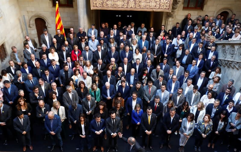 Catalan leader Quim Torra gestures as he meets with mayors of Catalonia region, at the Palau de la Generalitat in Barcelona