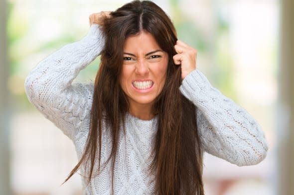 Portrait Of A Young Angry Woman at her home