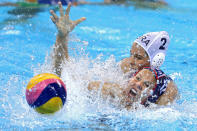 <p>Kami Craig #12 of United States and Diana Abla #2 of Brazil battle for possession of the ball on Day 10 of the 2016 Rio Olympics at Olympic Aquatics Stadium during the Women’s Water Polo quarterfinal match on August 15, 2016 in Rio de Janeiro, Brazil. (Photo by Patrick Smith/Getty Images) </p>
