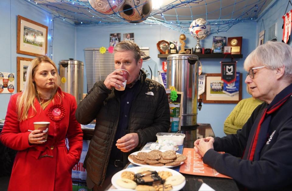 Sir Keir Starmer joins parliamentary candidate Gen Kitchen in Dale's Bar at the home of AFC Rushden & Diamonds (PA)