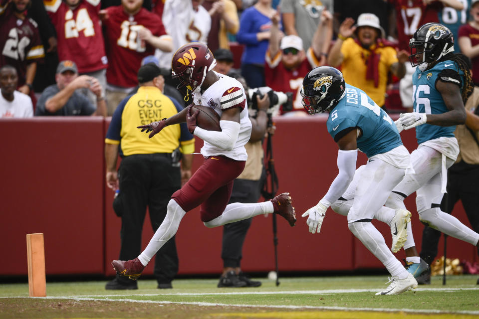 Washington Commanders wide receiver Terry McLaurin (17) running into the end zone to score a touchdown against the Jacksonville Jaguars during the second half of an NFL football game, Sunday, Sept. 11, 2022, in Landover, Md. (AP Photo/Nick Wass)