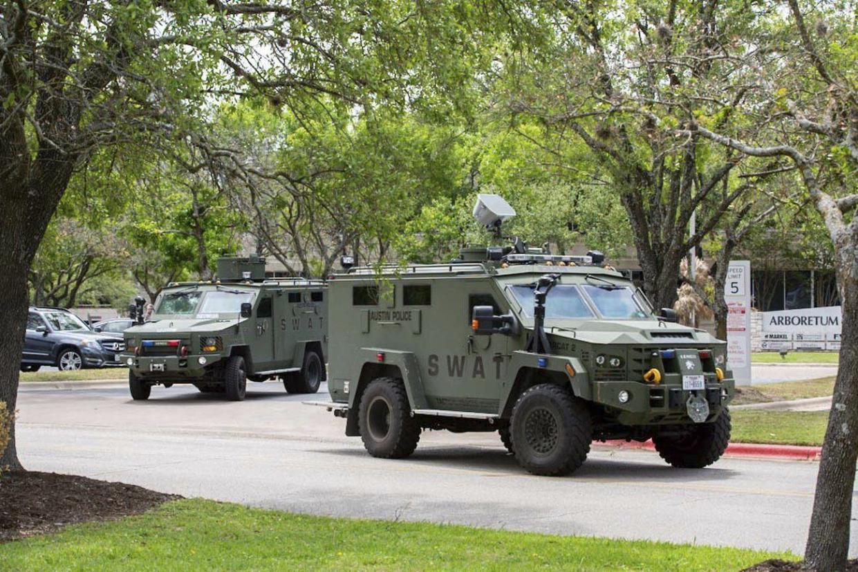 Police, SWAT and medical personnel respond to a fatal shooting in the Arboretum area of northwest Austin on Sunday, April 18, 2021.