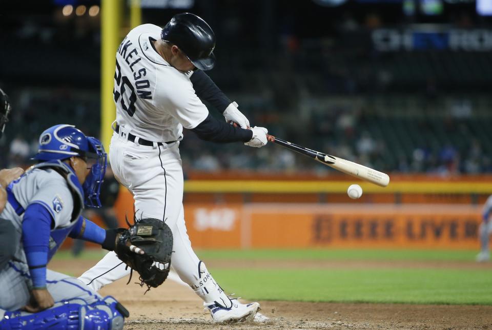 Detroit Tigers' Spencer Torkelson (20) hits a double to drive in two runs, with Kansas City Royals catcher Salvador Perez behind the plate, in the sixth inning of a baseball game Tuesday, Sept. 26, 2023, in Detroit. (AP Photo/Duane Burleson)