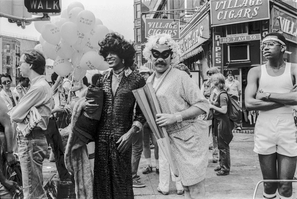 Gay liberation activist Marsha P. Johnson wears a black sequined jumpsuit during a 1982 Pride March. <a href="https://www.gettyimages.com/detail/news-photo/american-gay-liberation-activist-marsha-p-johnson-along-news-photo/1392246163?adppopup=true" rel="nofollow noopener" target="_blank" data-ylk="slk:Barbara Alper/Getty Images;elm:context_link;itc:0;sec:content-canvas" class="link ">Barbara Alper/Getty Images</a>