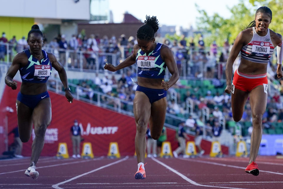 Javianne Oliver wins the second heat of the semi finals in women's 100-meter runat the U.S. Olympic Track and Field Trials Saturday, June 19, 2021, in Eugene, Ore. (AP Photo/Ashley Landis)