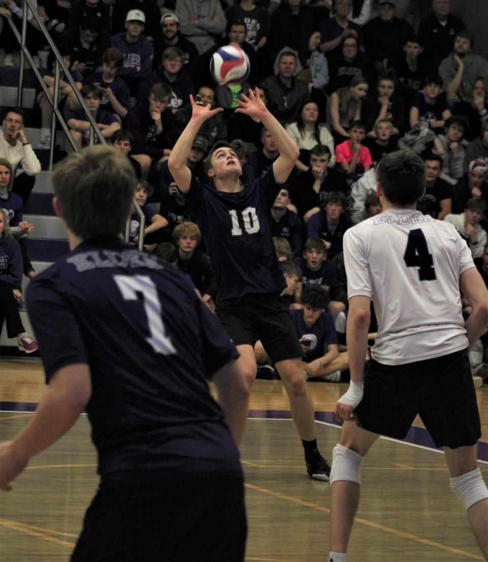 Elder junior Mitch Kelly sets the ball in a March 24 match.