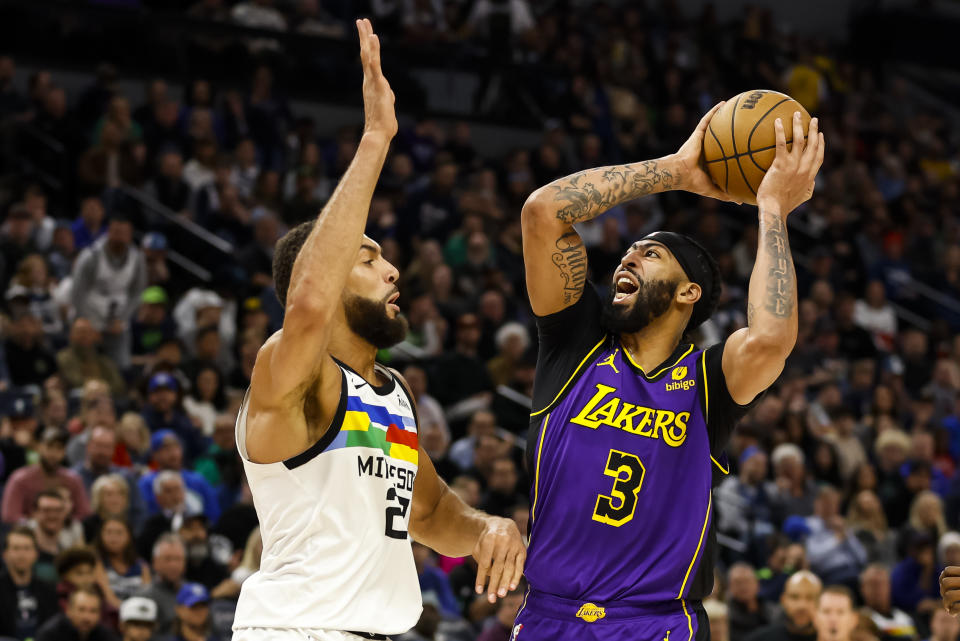 MINNEAPOLIS, MN - MARCH 31: Anthony Davis #3 of the Los Angeles Lakers goes to the basket while Rudy Gobert #27 of the Minnesota Timberwolves defends in the second quarter of the game at Target Center on March 31, 2023 in Minneapolis, Minnesota. NOTE TO USER: User expressly acknowledges and agrees that, by downloading and or using this Photograph, user is consenting to the terms and conditions of the Getty Images License Agreement. (Photo by David Berding/Getty Images)