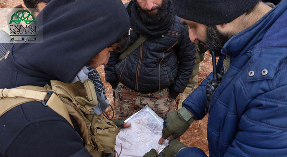 This picture posted on Dec. 11, 2016, by the Syrian militant group Ahrar al-Sham, purports to show Ahrar al-Sham fighters consulting a map in the countryside around the northern Syrian town of al-Bab, Aleppo province, Syria. Nearly two months into the assault, Turkey has become bogged down in an unexpectedly bloody fight to retake the Islamic State group’s last stronghold in northern Syria. It has been forced to pour in troops, take the lead in the battle from its Syrian allies and reach out to Russia for aerial support -- a move that tests its alliance with the United States and the Syrian opposition. (Ahrar al-Sham, via AP)
