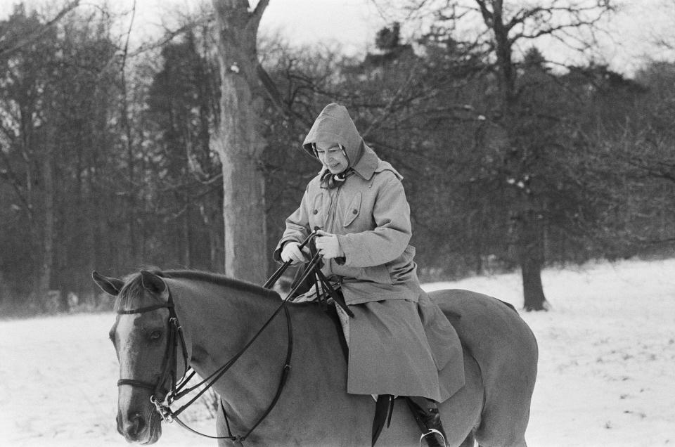 The Royal Family at Christmas and New Year. Queen Elizabeth II out riding her horse in the snow, during their New Year holiday at Sandringham, Norfolk. Picture taken 2nd January 1979. (Photo by Pete Case/Mirrorpix/Getty Images)