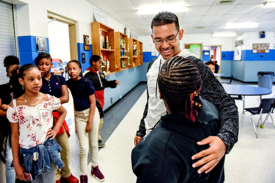 Robert Ray Jr. talks with Jackie Wilkerson during a visit on Wednesday, April 17, 2019, at the Boys & Girls Club of Lansing. Wilkerson works for Dean Transportation and drives kids to the facility.